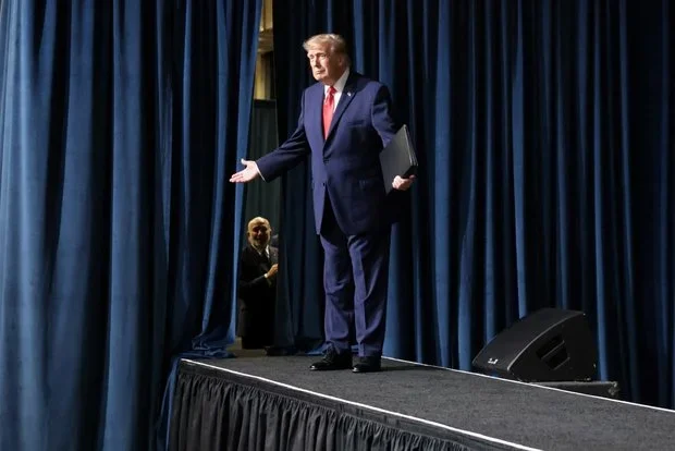 Trump pours water on stage while explaining fuel economy